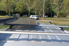 Solar panel with awning and roof rack